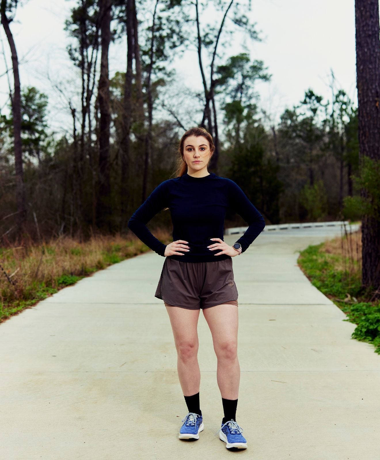 Female athlete posing with KARHU running shoes